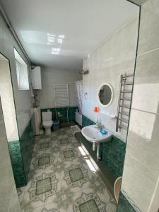 a bathroom with a sink and a toilet at Rest in Palanga in Palanga