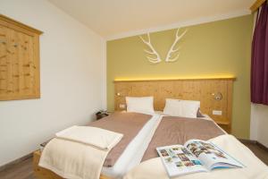 Postel nebo postele na pokoji v ubytování Comfort Hotel Garni Landhaus Gitti