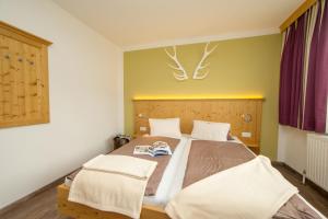 Postel nebo postele na pokoji v ubytování Comfort Hotel Garni Landhaus Gitti