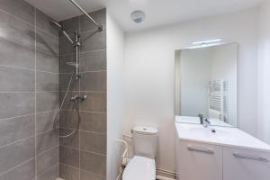 a bathroom with a shower and a toilet and a sink at Cute Studio close to Paris - 1P - 501 in Ivry-sur-Seine