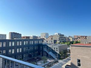 an aerial view of a city with buildings at Modern Spacious 3 Bedroom Apartment At Ricahrd Mortensens Vej With Balcony Close To The Royal Arena And Fields in Copenhagen