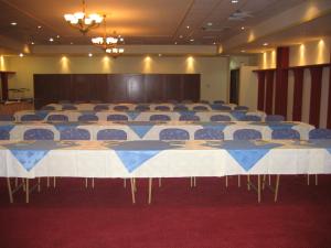 a conference room with a large table and chairs at Aktea Beach Village in Ayia Napa