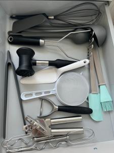a drawer filled with cooking utensils in a box at Doppelhaushälfte mit Terrasse in Lichtenhagen
