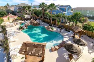 an aerial view of a pool at a resort at BC604 Roomy Townhome, Outdoor Seating, Shared Heated Pool with Water Slide in Port Aransas