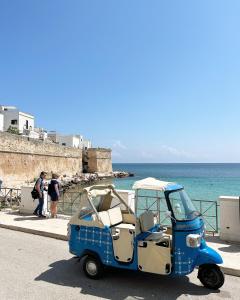 a small vehicle parked on the side of a beach at Donna Nina in Monopoli