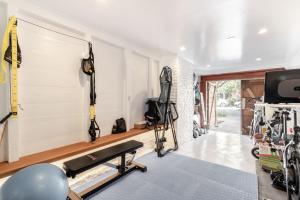 a fitness room with a treadmill and a gym at STYLISH AND SPACIOUS 2ND Flr 2 BR VICTORIAN HOME in San Francisco