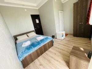 Postel nebo postele na pokoji v ubytování New Batumi
