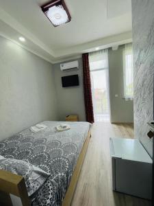 Postel nebo postele na pokoji v ubytování New Batumi