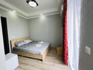 Postel nebo postele na pokoji v ubytování New Batumi