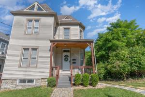 a house with a front door with a porch at Amazing Downtown Views - 3 Minutes to Downtown! in Cincinnati