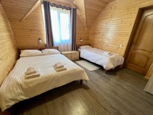 Postel nebo postele na pokoji v ubytování Боброва-Хата