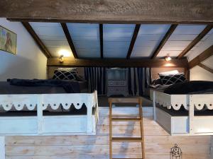 Postel nebo postele na pokoji v ubytování La maison de Mamie