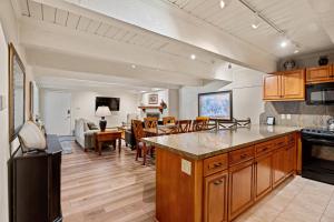 a kitchen and living room with a counter and a living room at Cottonwoods 1-D in Aspen