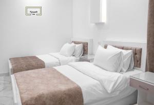 Letto o letti in una camera di Egyptus Pyramids Inn