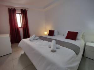 a bedroom with two beds with towels on them at Perfect place in Il-Gżira