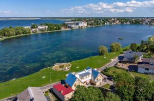 an aerial view of a house on the shore of a river at Villa Marienholm in Haapsalu