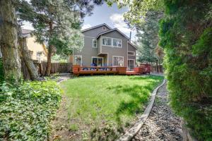 a home with a yard with a house at Spacious Reno Home with Deck about 1 Mi to Downtown! in Reno