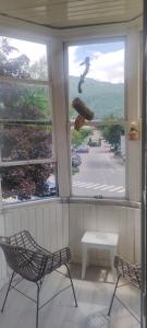a room with two chairs and a window with a view at Zentrale Lage in Bad Ischl - Top 2 in Bad Ischl