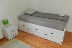 Postel nebo postele na pokoji v ubytování Dobi Apartmani WING
