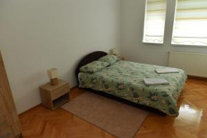 Postel nebo postele na pokoji v ubytování Dobi Apartmani WING