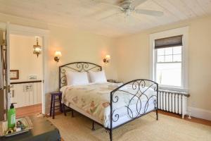 a bedroom with a bed and a ceiling fan at Beautifully Renovated in Harwich Center in Harwich