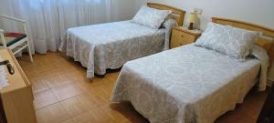 Postel nebo postele na pokoji v ubytování Camiño Loureiro