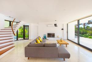 a living room with a couch and a table at villa ozma in Kaş