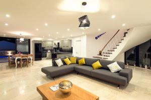 a living room with a couch and a table at villa ozma in Kaş