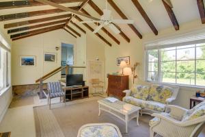 a living room with a couch and a tv at Mattapoisett Home on 7 Acres with Private Beach! in Mattapoisett