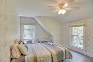 a bedroom with a bed and a ceiling fan at Mattapoisett Home on 7 Acres with Private Beach! in Mattapoisett