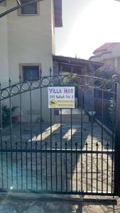 a sign on a gate with a villa not sign on it at Villa Mor Fethiye in Fethiye