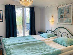 Postel nebo postele na pokoji v ubytování Holiday home KLÄSSBOL II