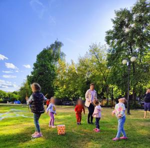 a group of children playing in a park at Prawdzic Family Resort & Wellness in Gdańsk