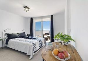 Postel nebo postele na pokoji v ubytování Yinfa 1 Sunset Apartment