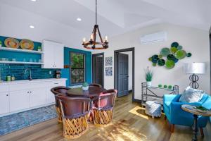 a kitchen with a table and a blue couch at Terlingua at the Bend in Wimberley