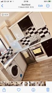 a bathroom with a washing machine in a kitchen at Ac lounge36 Room B in Rochford +17 photos