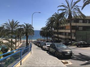 a street with cars parked next to the beach at Captivating 2-Bed Apartment in Aguadulce in Aguadulce