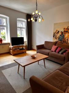 a living room with a couch and a coffee table at Ferienwohnungen Café Cup in Detmold