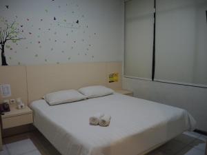 Postel nebo postele na pokoji v ubytování SWK 95 Hotel
