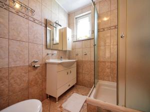 a bathroom with a toilet and a sink and a shower at Apartments Vladimir in Vodice +51 photos
