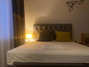 Postel nebo postele na pokoji v ubytování ZANI Hostel