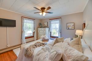 a living room with a couch and a ceiling fan at Lovely Hammondsport Home, Walk to Keuka Lake! in Hammondsport
