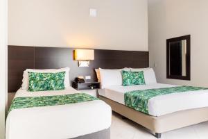 Łóżko lub łóżka w pokoju w obiekcie Hotel Manantial Melgar