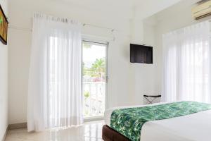 Łóżko lub łóżka w pokoju w obiekcie Hotel Manantial Melgar