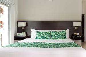 Łóżko lub łóżka w pokoju w obiekcie Hotel Manantial Melgar