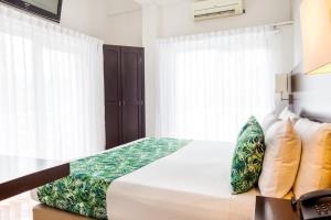 Łóżko lub łóżka w pokoju w obiekcie Hotel Manantial Melgar