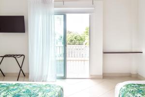 Łóżko lub łóżka w pokoju w obiekcie Hotel Manantial Melgar