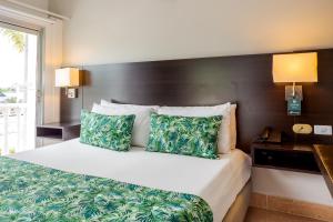 Łóżko lub łóżka w pokoju w obiekcie Hotel Manantial Melgar