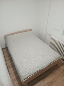 a mattress on a bed frame in a room at stan na dan IM in Užice