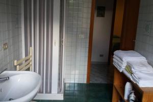 a bathroom with a sink and a shower with a tub at Casa Catalogna , Vicino al centro storico. in Lipari +30 photos